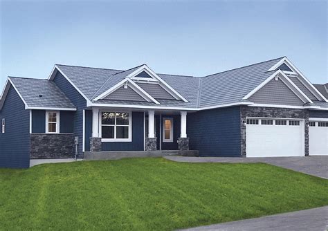 blue cottage house metal roof|house with blue roof exterior.